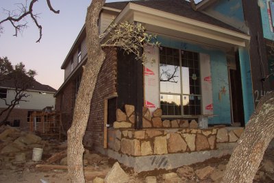 Front corner with brick and stone