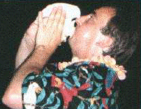 [ Image: A picture of OPHarbour playing the Conch shell ]